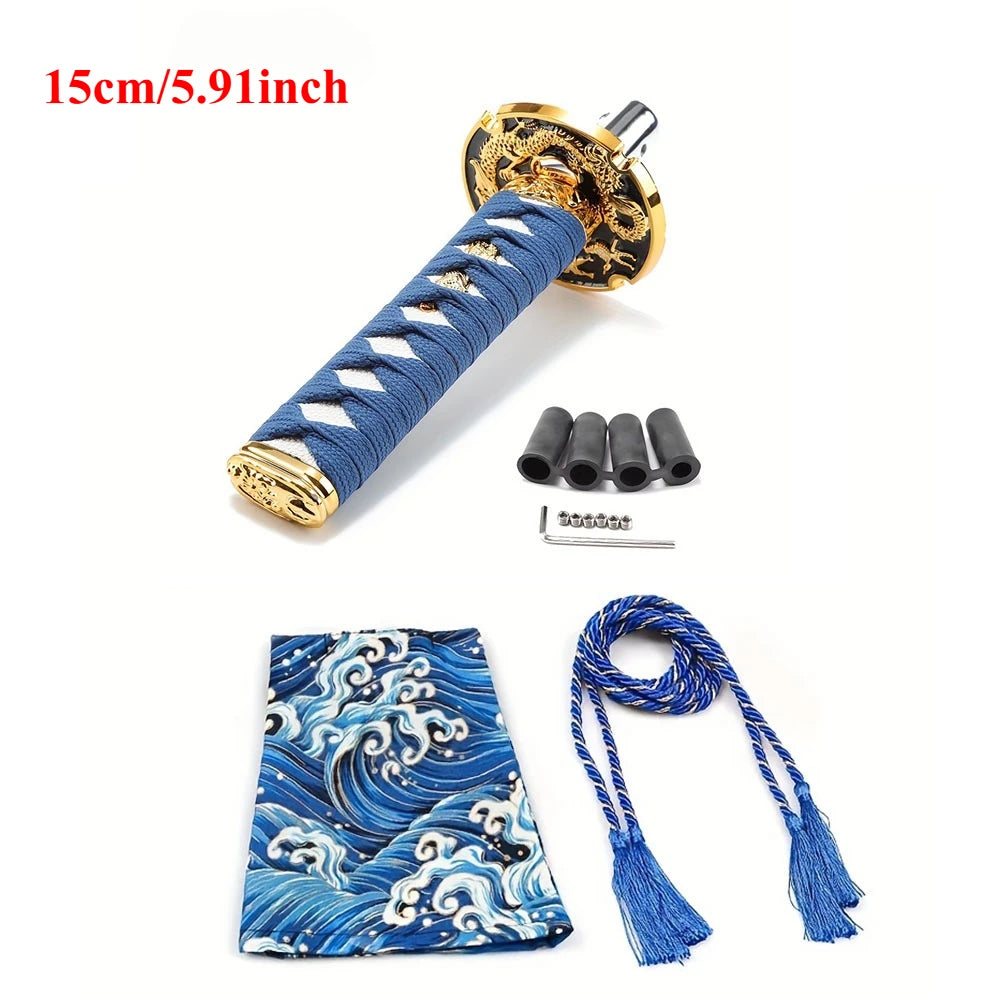 Samurai katana style manual shift knob with wrapped black and red grip installed in a car interior