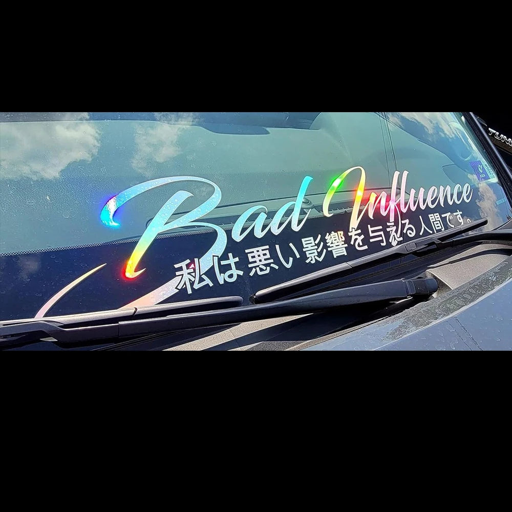 Bad Influence windshield sticker with Japanese text displayed on a red modified sports car