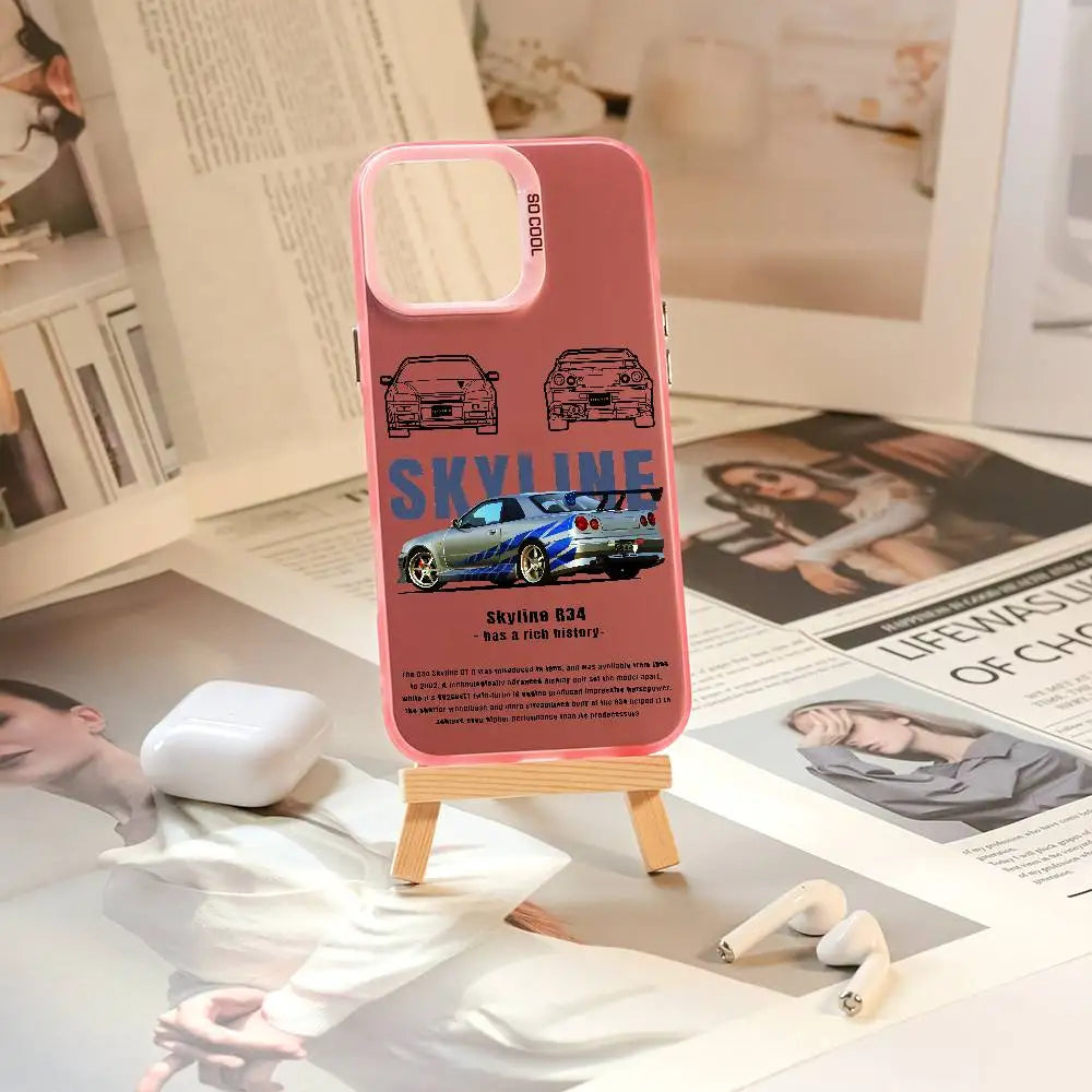 Nissan Skyline R34 phone cases featuring blue and purple JDM car artwork, technical illustrations, and automotive photography