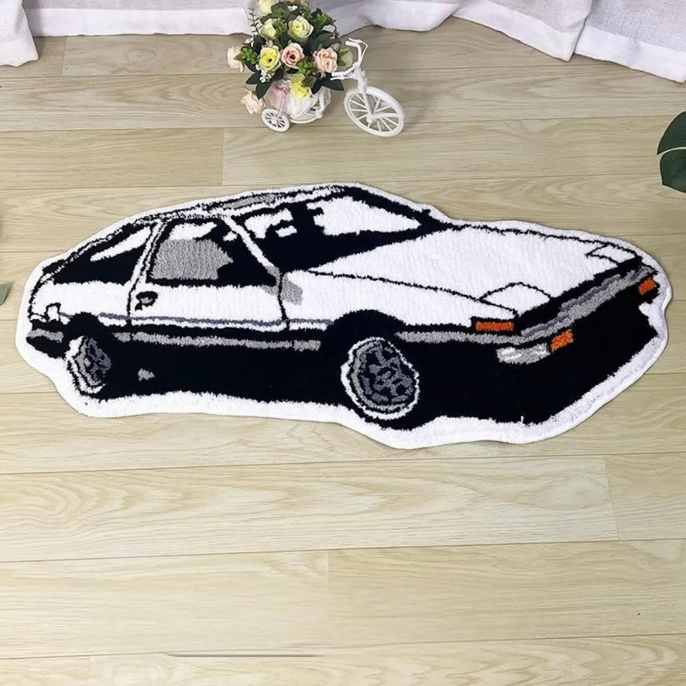 Car shaped area rug featuring a blue sports car design on a light wood floor