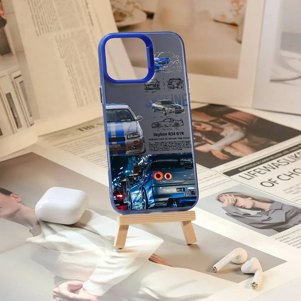 Nissan Skyline R34 phone cases featuring blue and purple JDM car artwork, technical illustrations, and automotive photography