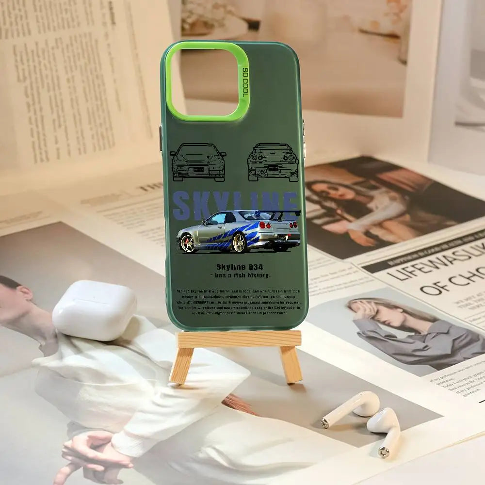 Nissan Skyline R34 phone cases featuring blue and purple JDM car artwork, technical illustrations, and automotive photography
