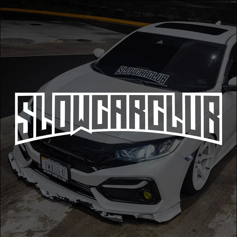 White SHOWCAR windshield sticker on a modified white car