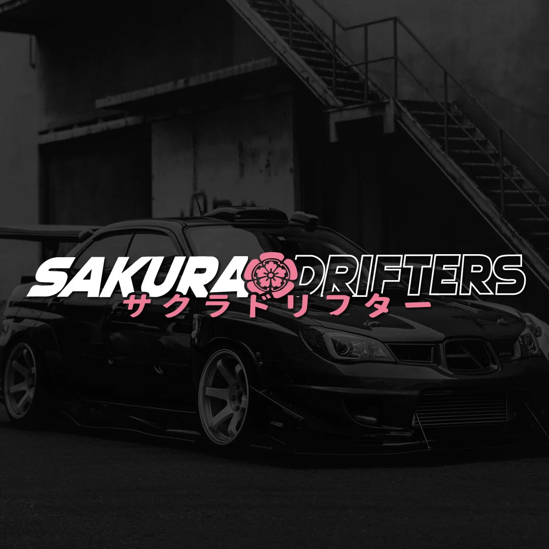 Sakura Drifters windshield sticker with pink cherry blossom design on a black modified car