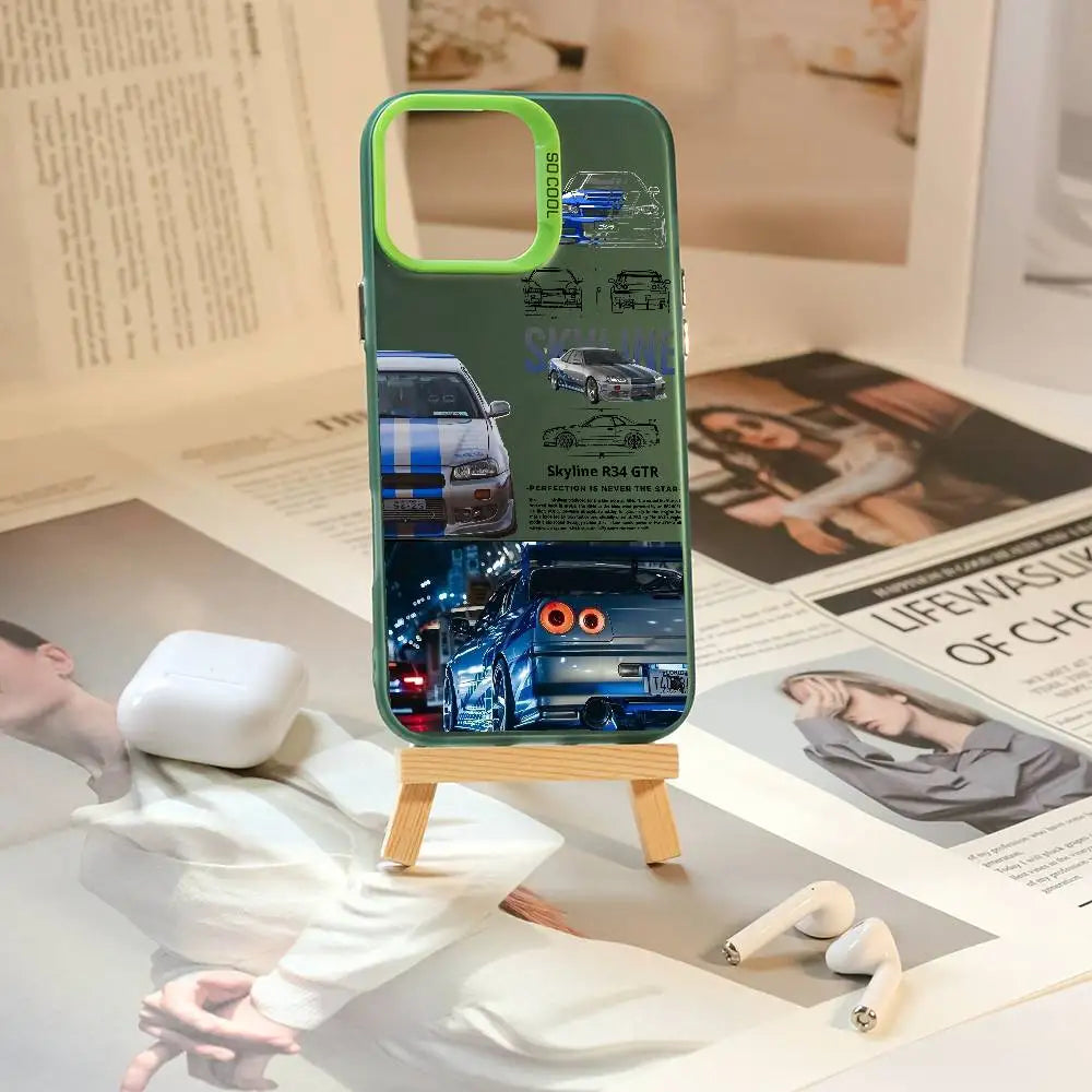 Nissan Skyline R34 phone cases featuring blue and purple JDM car artwork, technical illustrations, and automotive photography