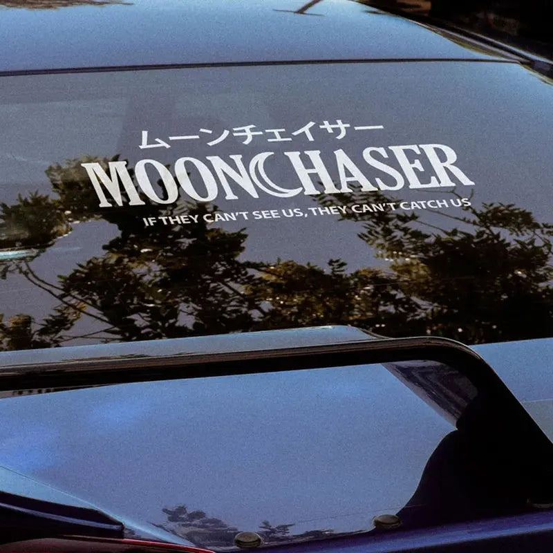 White Moonchaser Japanese style sticker displayed on a car windshield