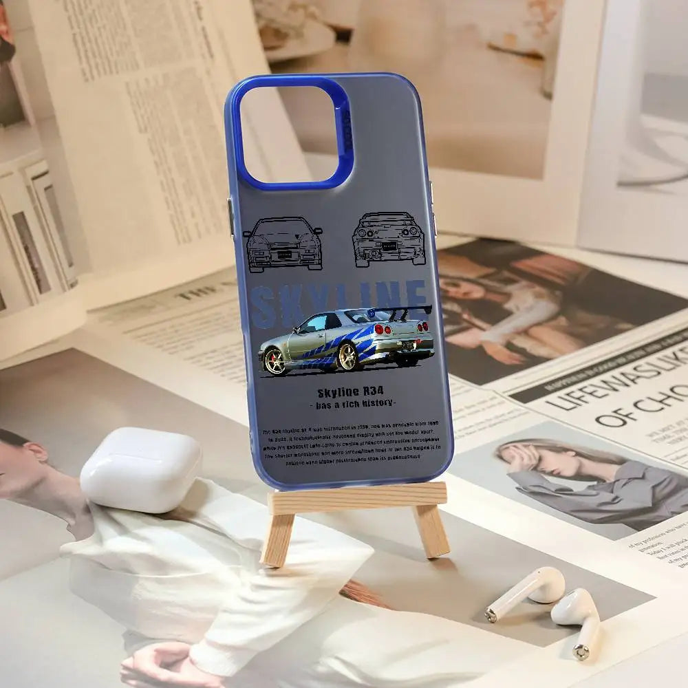 Nissan Skyline R34 phone cases featuring blue and purple JDM car artwork, technical illustrations, and automotive photography