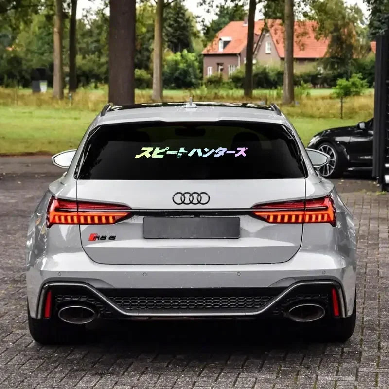 Speed Hunters Japanese lettering windshield sticker displayed on a white sports car