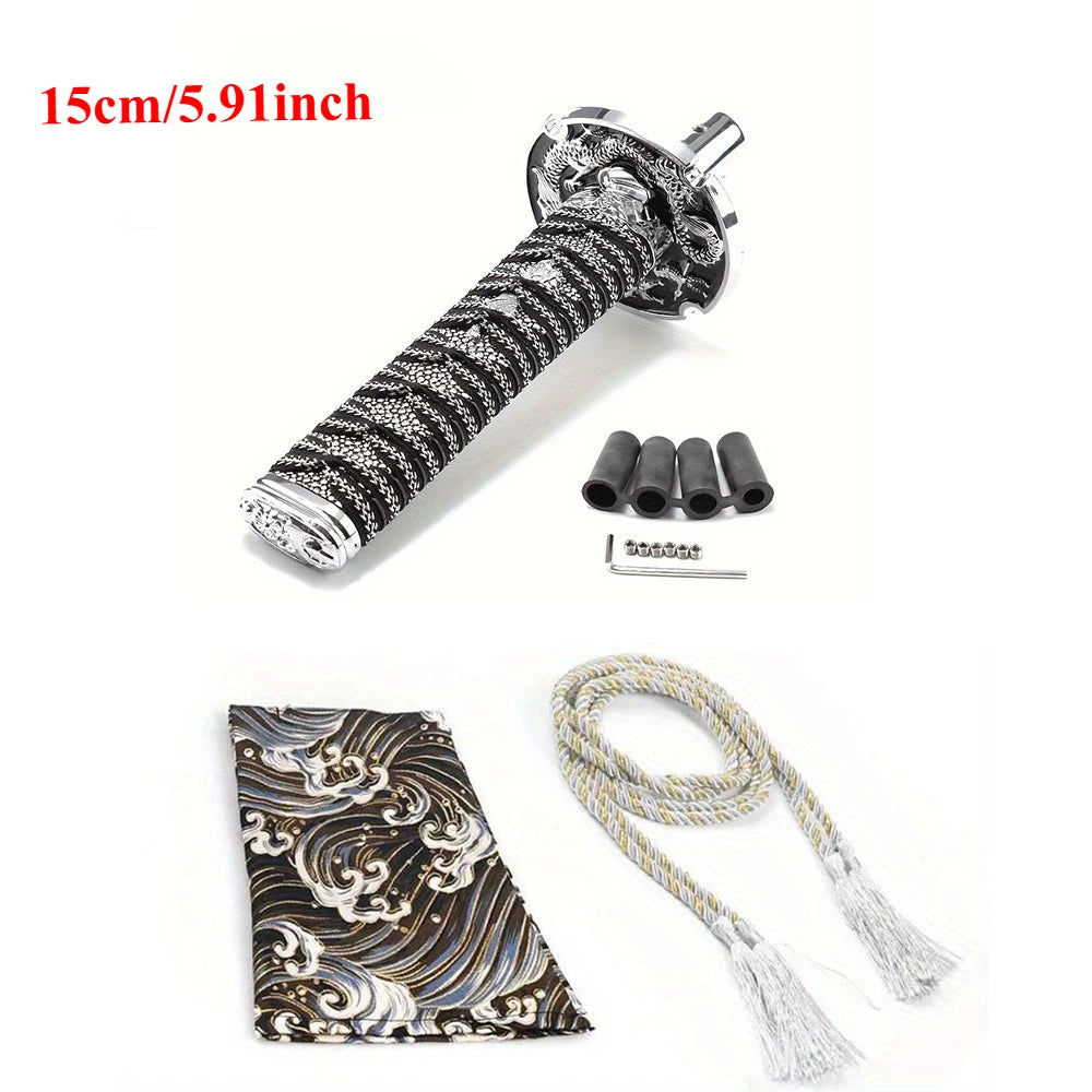 Samurai katana style manual shift knob with wrapped black and red grip installed in a car interior