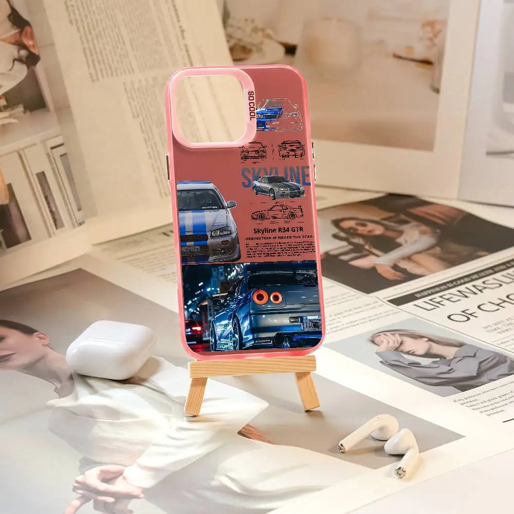 Nissan Skyline R34 phone cases featuring blue and purple JDM car artwork, technical illustrations, and automotive photography