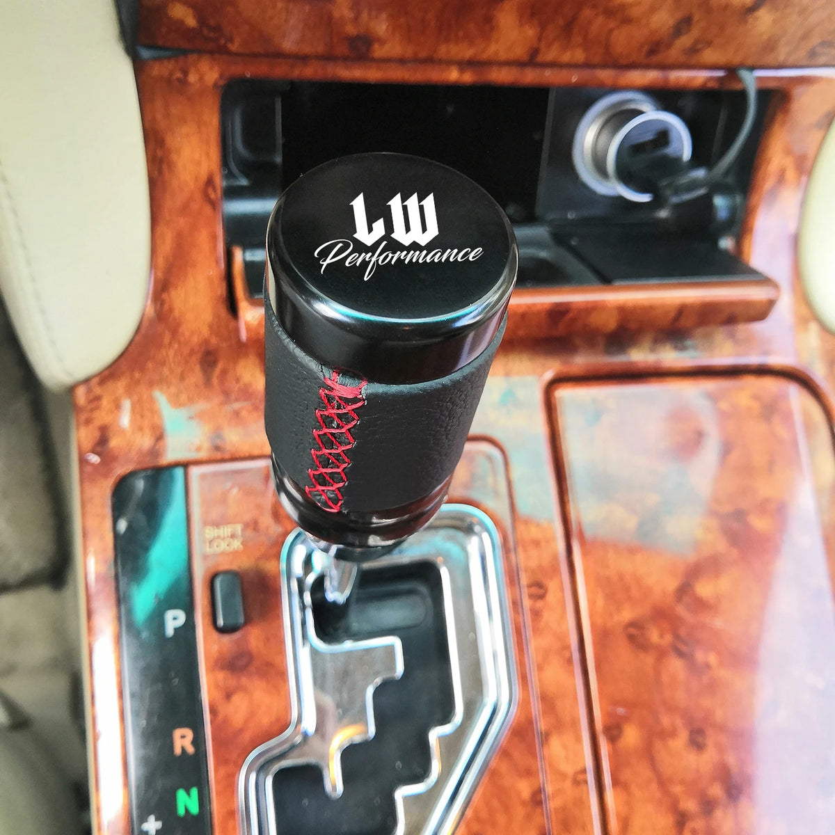 Black leather-style JDM manual shift knob with red stitching and performance design