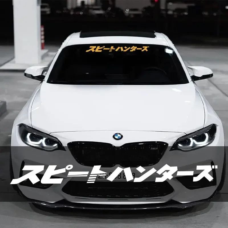 Speed Hunters Japanese lettering windshield sticker displayed on a white sports car
