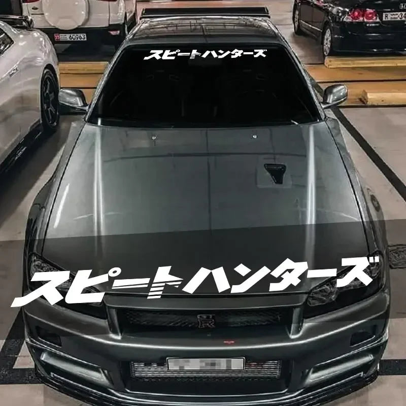 Speed Hunters Japanese lettering windshield sticker displayed on a white sports car
